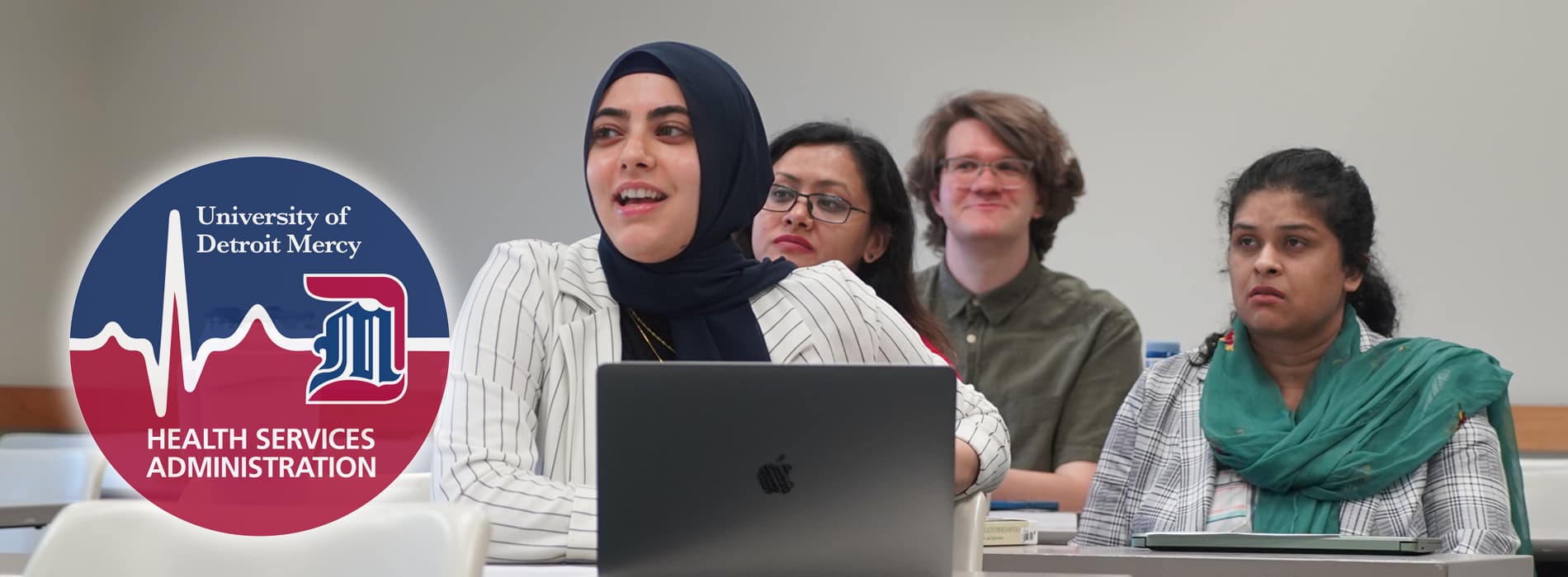 hsa students in class includes a diverse group of women and one man