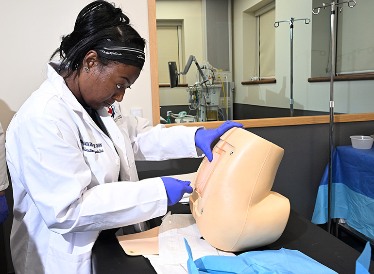 student gives an injection at intensive skills day