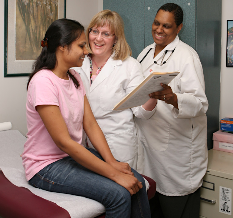 Nurses consulting with an outpatient.