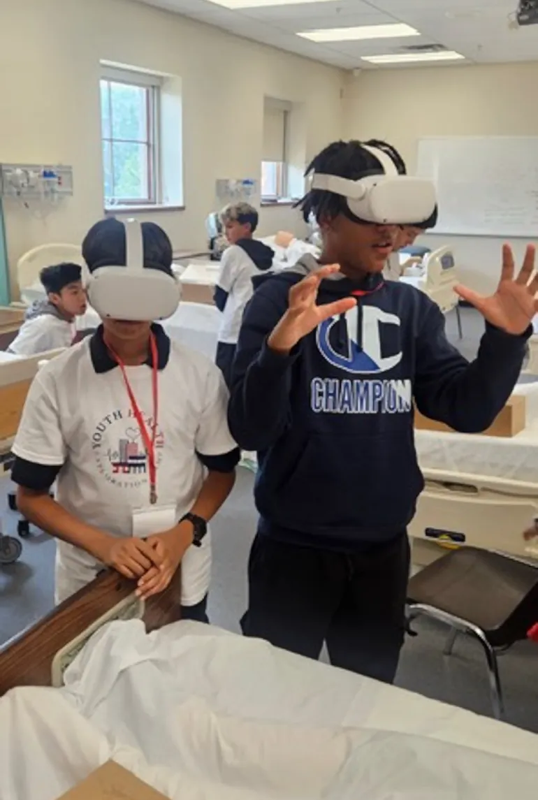 Campers wearing virtual reality headsets