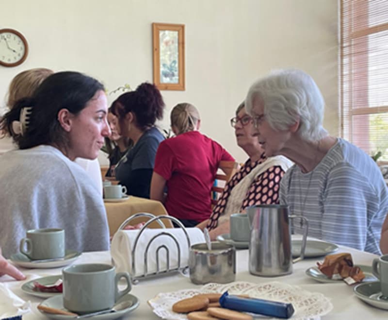  Grace Maloof, UDM School of Nursing student, enjoys conversation with a Sister of Mercy living at Coolock House.